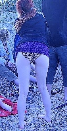 skinny teen in leo pants posing at the beach