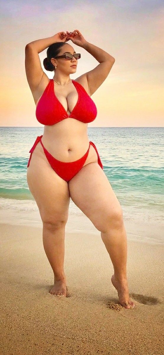 Katelyn Sade posing in a Red bikini