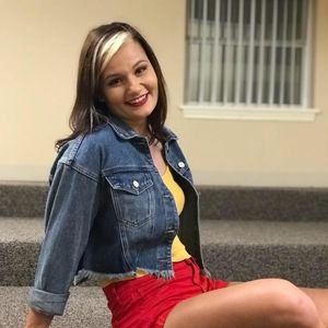 teen posing red shorts jean jacket
