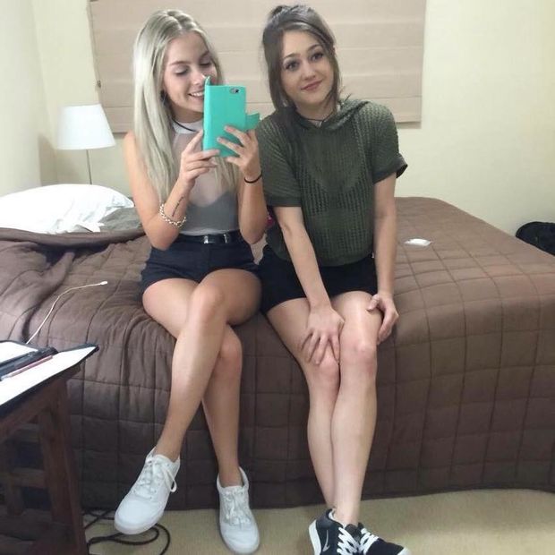 sitting on bed mirror selfie