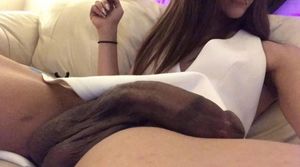 She has Long dark cock + balls