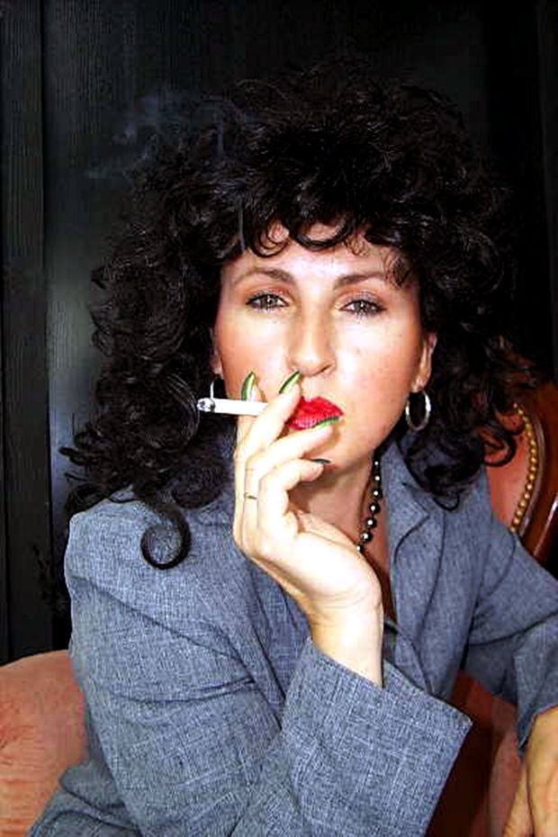 Bitch enjoying a cigarette before she gets ganged fucked by 7 mandingo's!