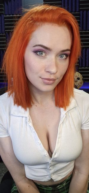 Pretty redhead with cleavage