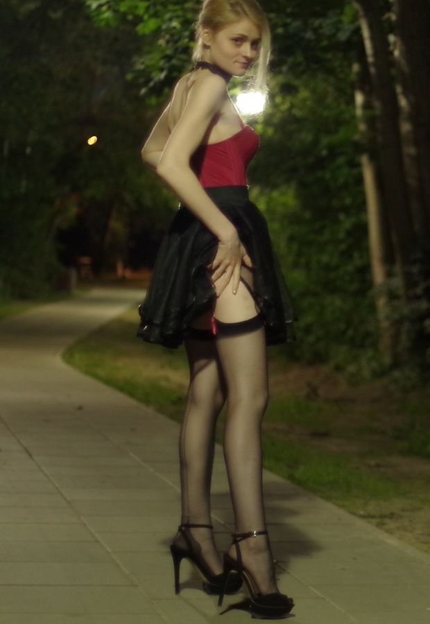 Leggy blonde babe posing outdoors
