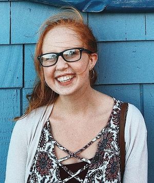 cute redhead teen with glasses
