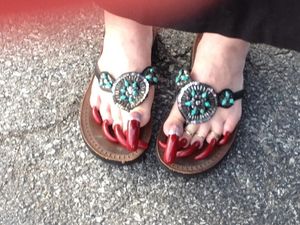 Reverse French pedicure in red.