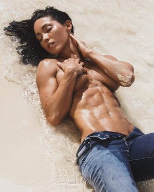 Julia Shelley laying on the sand