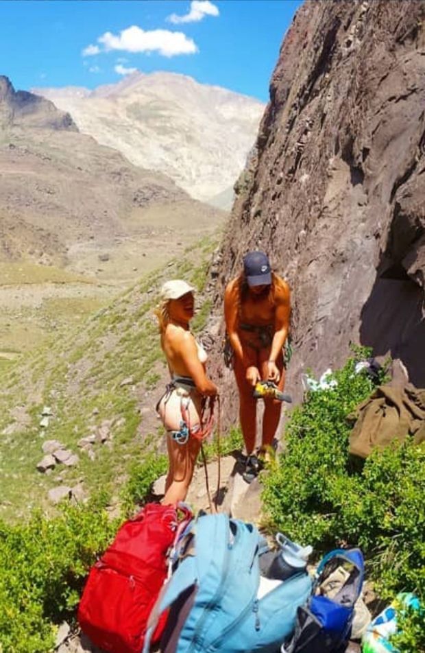 Catching two nude women about to climb.