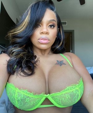 Dominique Chinn in a Green bra