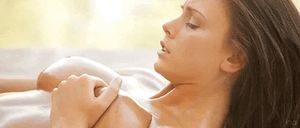 Firm hold of her tit while rubbing her pussy