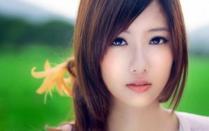 Beautiful Japanese face with pretty brown eyes and hair