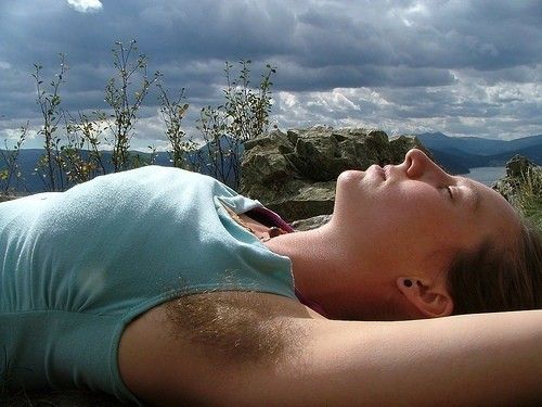 Airing out her hairy pits