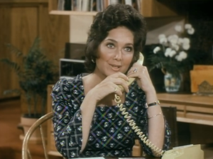 Who is she on the phone with?