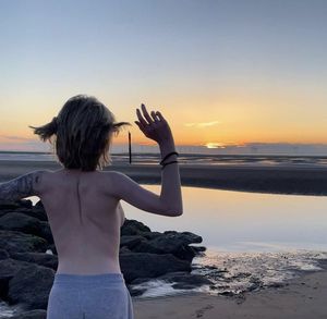 Teen going topless at the beach