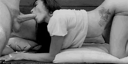 she sticks her ass in the air and sucks a hard cock