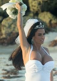 Brides tit pops out of cleavage