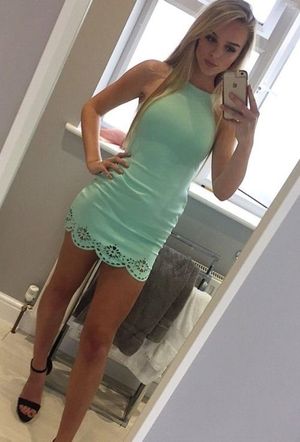Blonde in a tight green dress