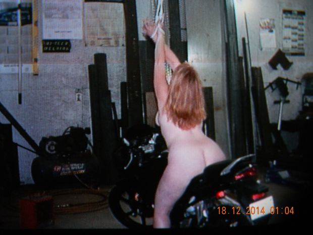 bare naked redhead on a bike