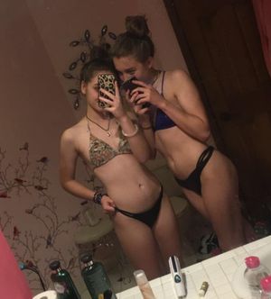teen friends taking slutty pictures in the mirror