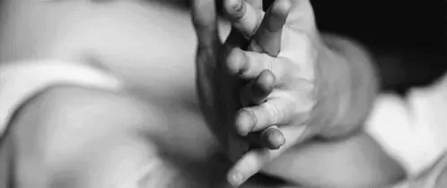 Holding hands in bed