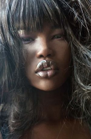 ebony female face with glossy full lips