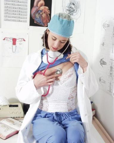 Nurse lifting up her shirt and listening to her heartbeat.