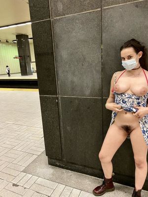 Flashing her charms in the subway