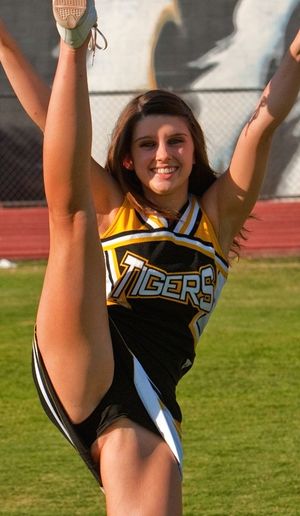 Dad taking a picture of his daughter at the game, thinking she going be pregnant by some black guy before she turns 15!