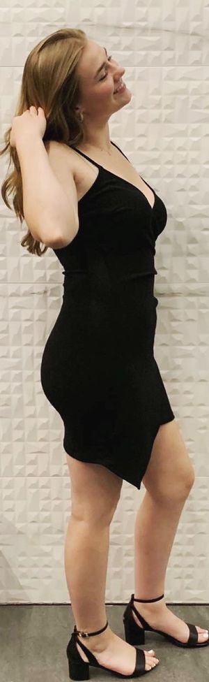 dumb blonde slut posing in a black dress