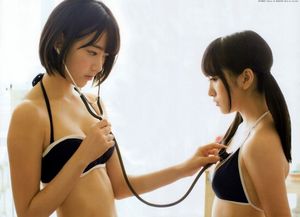 Japanese chick listening to her heartbeat with a stethoscope.