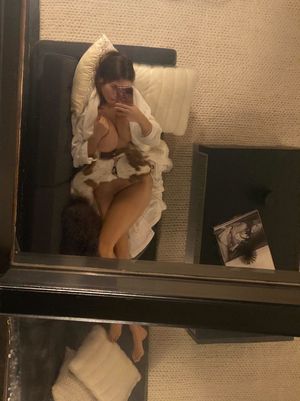 Dog under tits on lap