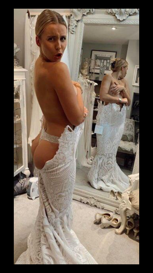 Blonde bride in wedding dress with her ass out