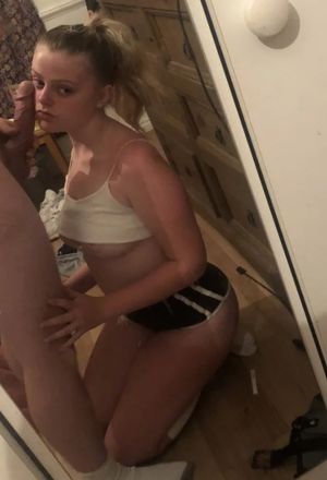 Teen mirror view of her about to give head