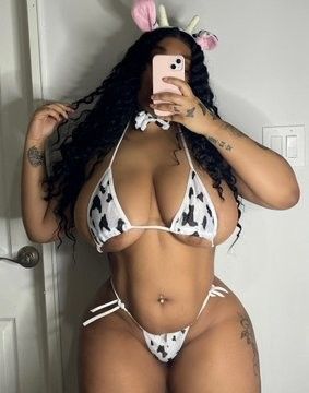 Wetlikekior in a cow-themed bikini