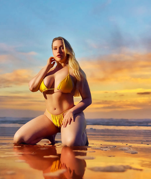 Busty blonde at the beach