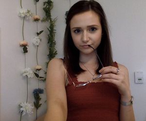 cute slut seductive pose with glasses in her mouth