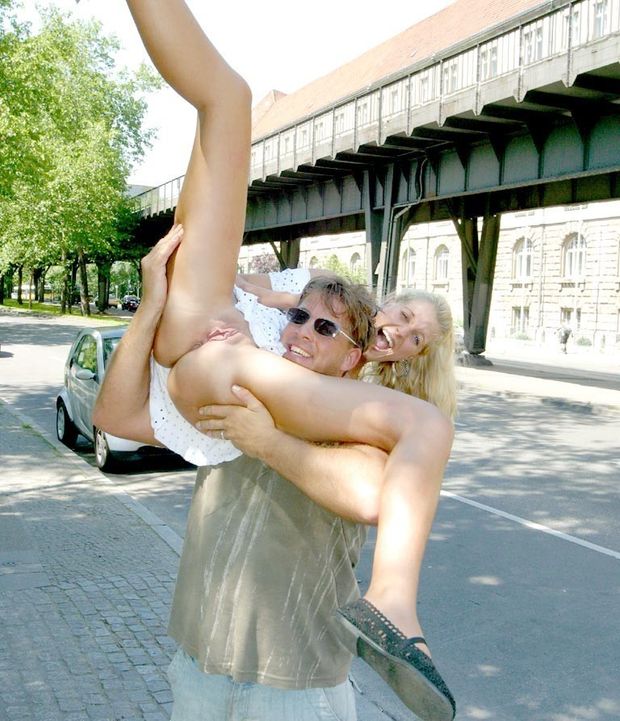 Woman lifted by man to show her ass and pussy