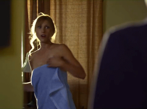 Woman's towel falls off in front of man