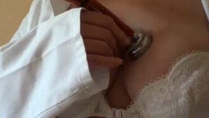 Chick in bra listening to her heartbeat with her stethoscope