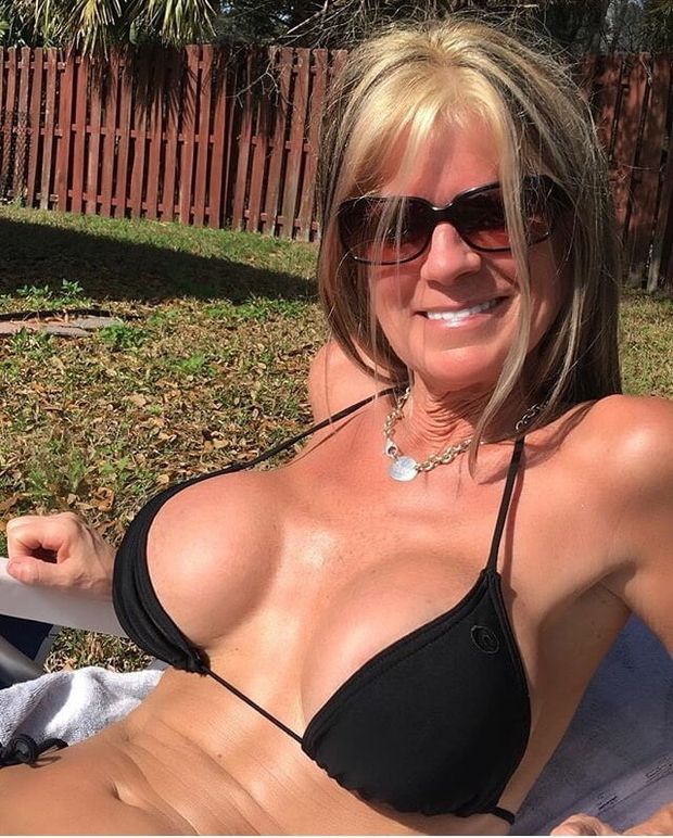 Sexy milf enjoying the sun