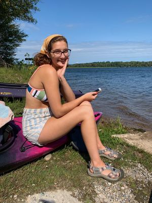 cute teen sitting outside