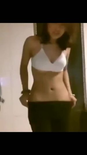 Brunette amateur showing twins in bra.