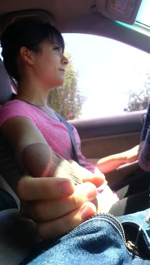 short haired woman strokes a cock in the car