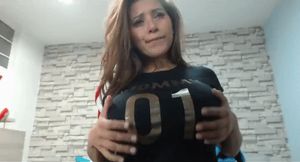 Exposing her big brown areolas