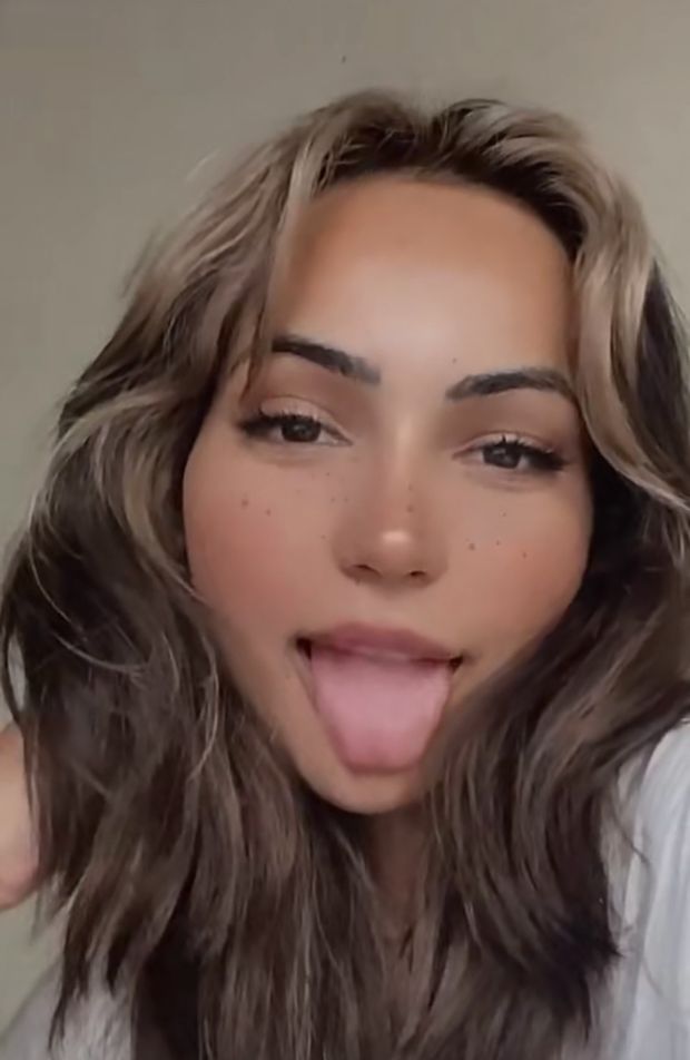 Pretty babe with her tongue out for cum