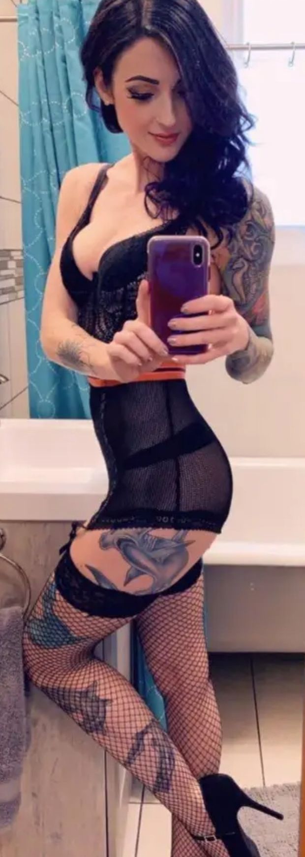 Gorgeous tattooed brunette