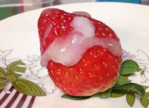 cream and a strawberry