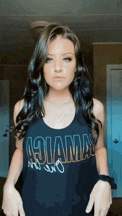 Michelle James pulls up her shirt to show you her nip piercings