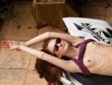 Cute brunette showing her nice little titties