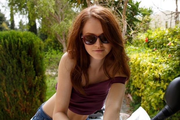 Cute brunette falling out of her shirt